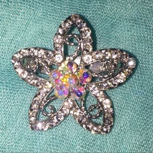 Iridescent flower brooch